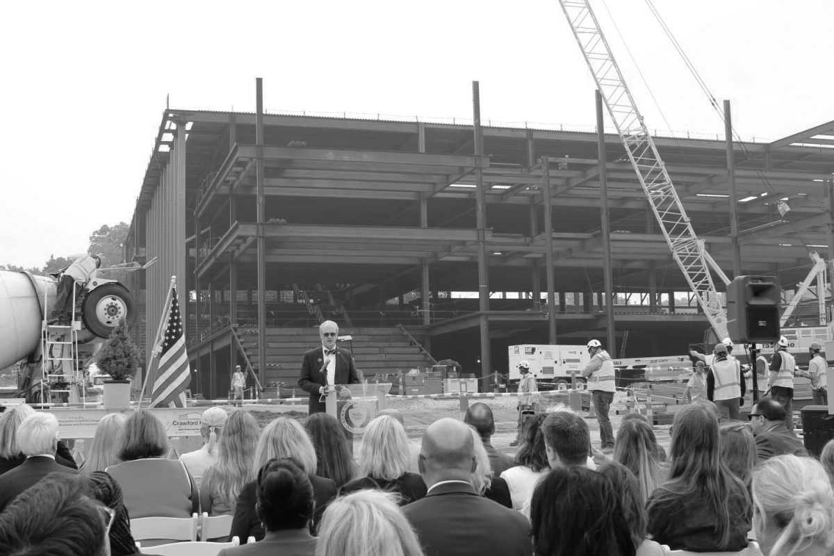 President Todd Diacon addresses a crowd of trustees, administrators and others at the Crawford Hall topping out ceremony June 28, 2023.