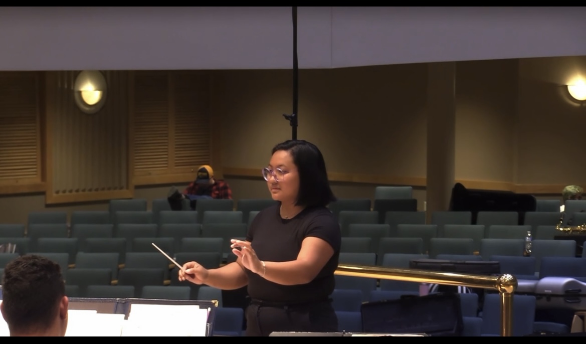 Catarina Tran conducts an ensemble in Cartwright Hall. Courtesy of Catarina Tran