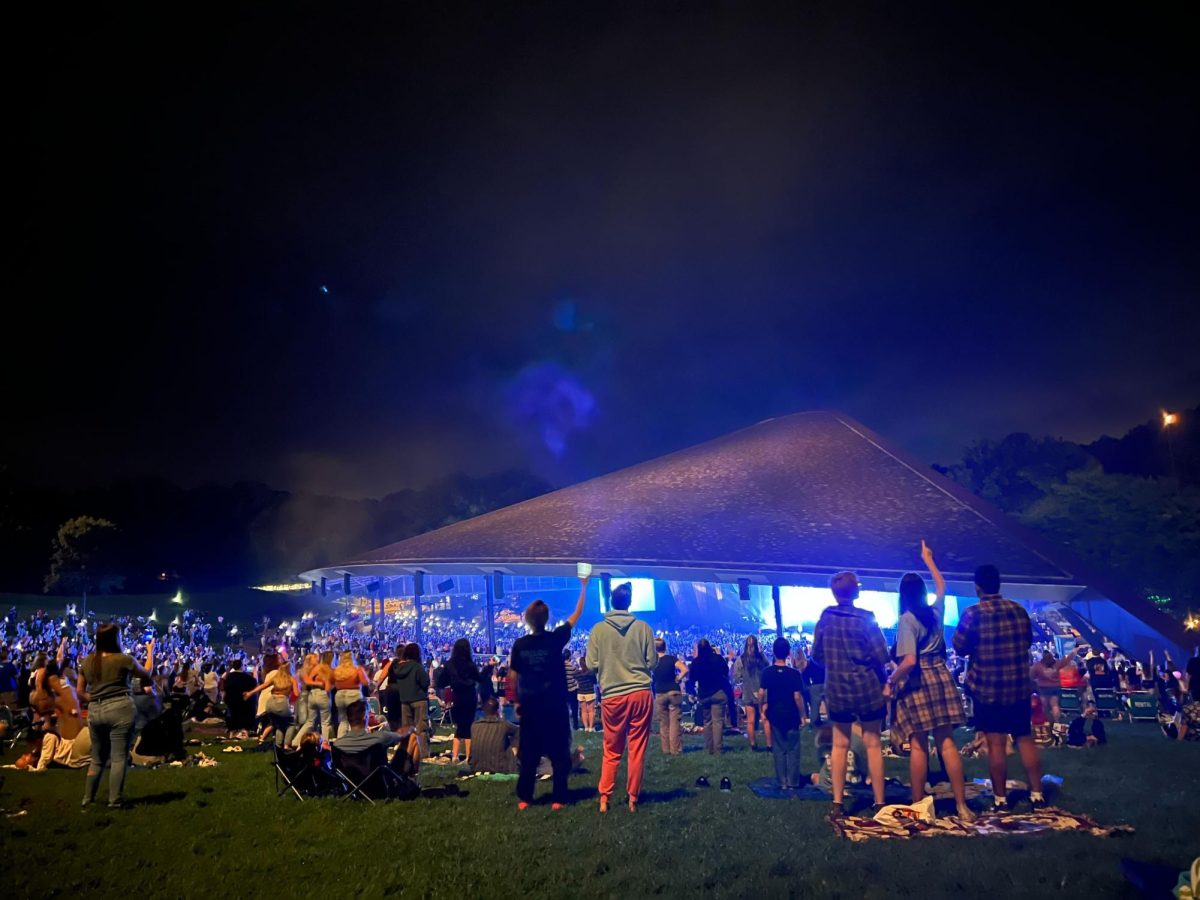 The crowd from the lawn seats at Blossom cheers on the 5SOS band members as they perform Friday night. 