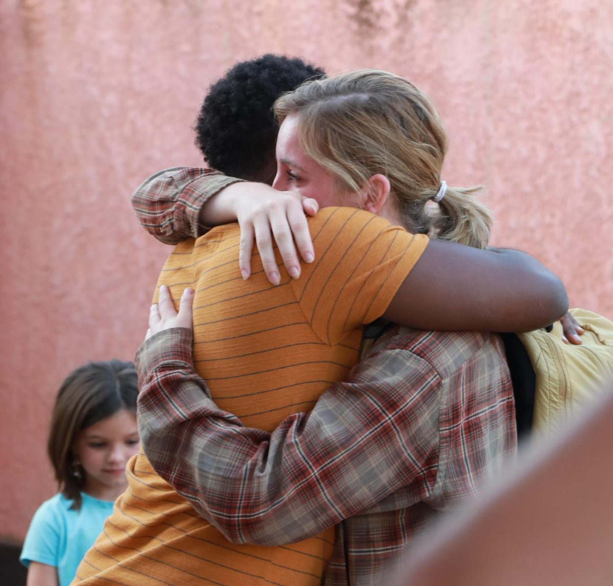 Emily Spencer, Kent State family studies student, hugs Pacifique goodbye on her way to the airport, leaving the trip a few days early for work.