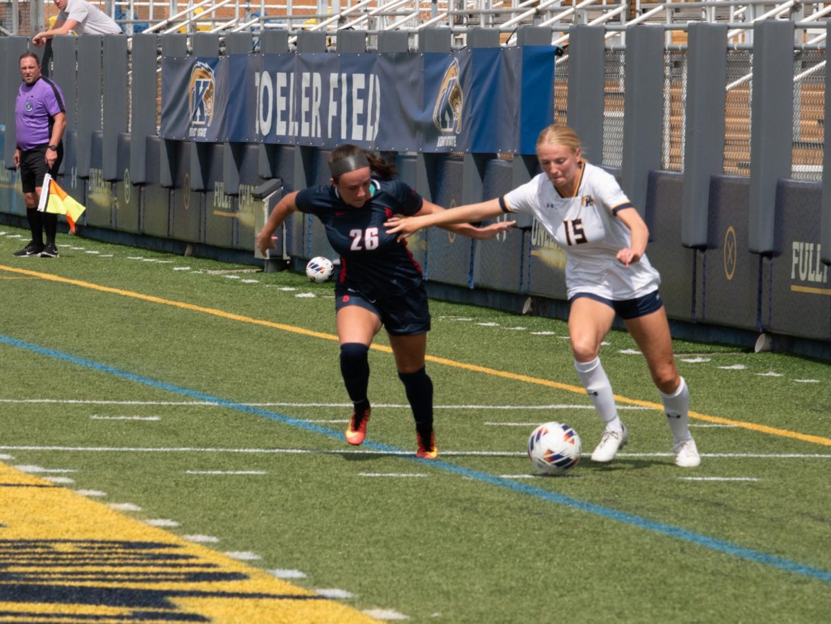 Mary Kate Lape (right) fends off Devin Lillis (left) at Kent State's senior day matchup against Duquesne Sep. 10, 2023.