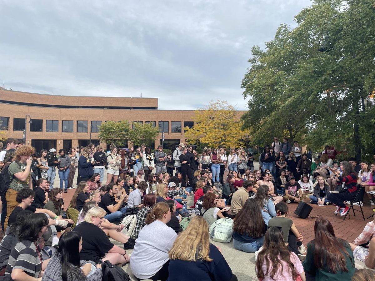 Cindy Smock, the Tiktok campus preacher known as "Sister Cindy", preaches to a group of students on Risman Plaza Sept. 25, 2023