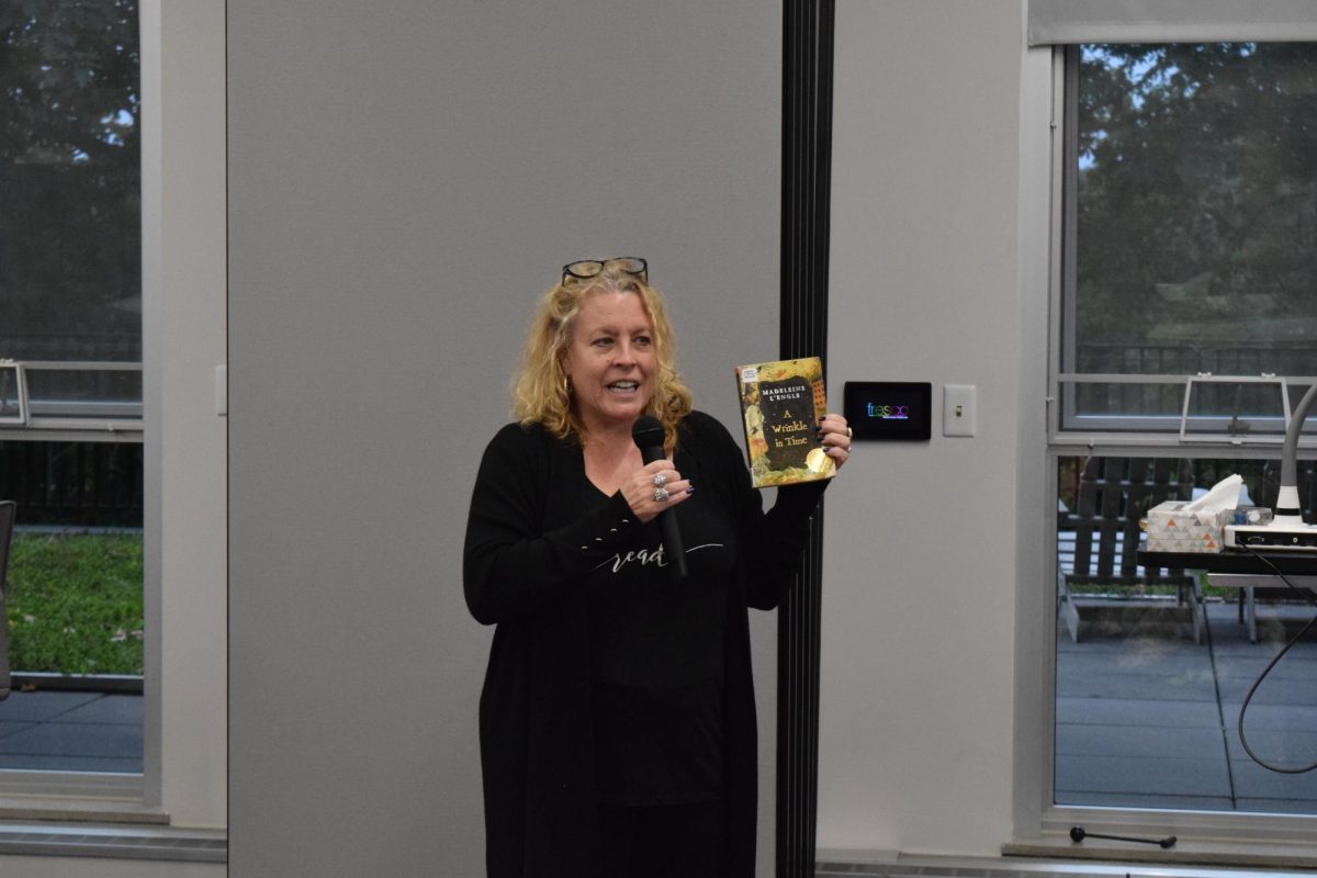 Director Meghan Harper talks to the crowd in Taylor Hall and reads excerpts from A Wrinkle in Time by: Madeleine L'Engle at the Banned Book Read-In on Sept. 27, 2023.