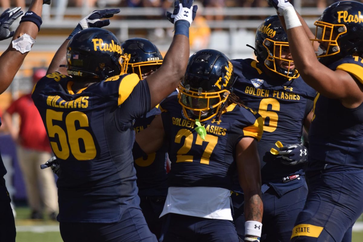 Graduate student Bryce Sheppert celebrates with the team after a good play against Miami University on Sept. 30, 2023.