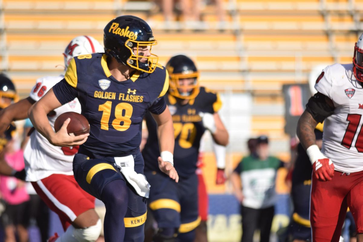 Quarterback Redshirt Junior, Michael Alaimo, runs the ball against the Miami University defense on Sept. 30, 2023.