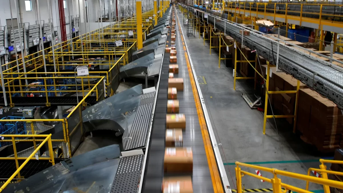 A fast-moving conveyor move packages to delivery trucks during operations on Cyber Monday at Amazon's fulfillment center in Robbinsville, New Jersey, U.S., November, 29 2021.