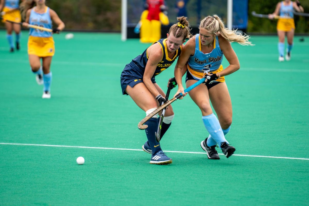 Junior Madison Leety battles Michigan's freshman Abby Burnett for the ball on Sept 17, 2023.