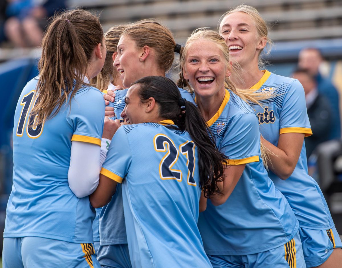 The Kent State soccer team celebrates after then-junior Alisa Arthur scores the first goal of the game against CMU on Oct. 8, 2023. The Golden Flashes went on to win the game 3-1.