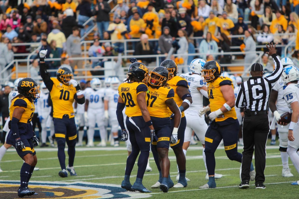 The Kent State football team celebrates during the first quarter of the homecoming game against Buffalo Oct. 21, 2023.