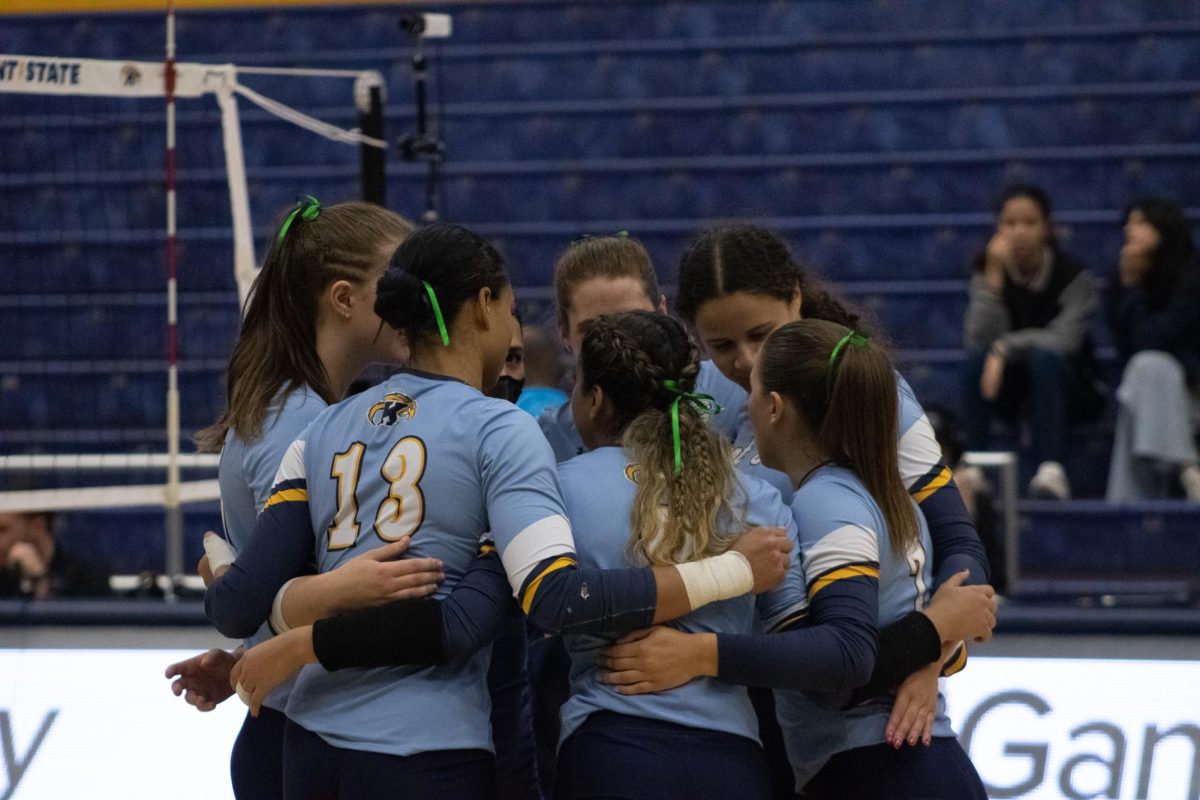 Kent State's volleyball team huddles together before their game against Western Michigan on Oct. 5, 2023.