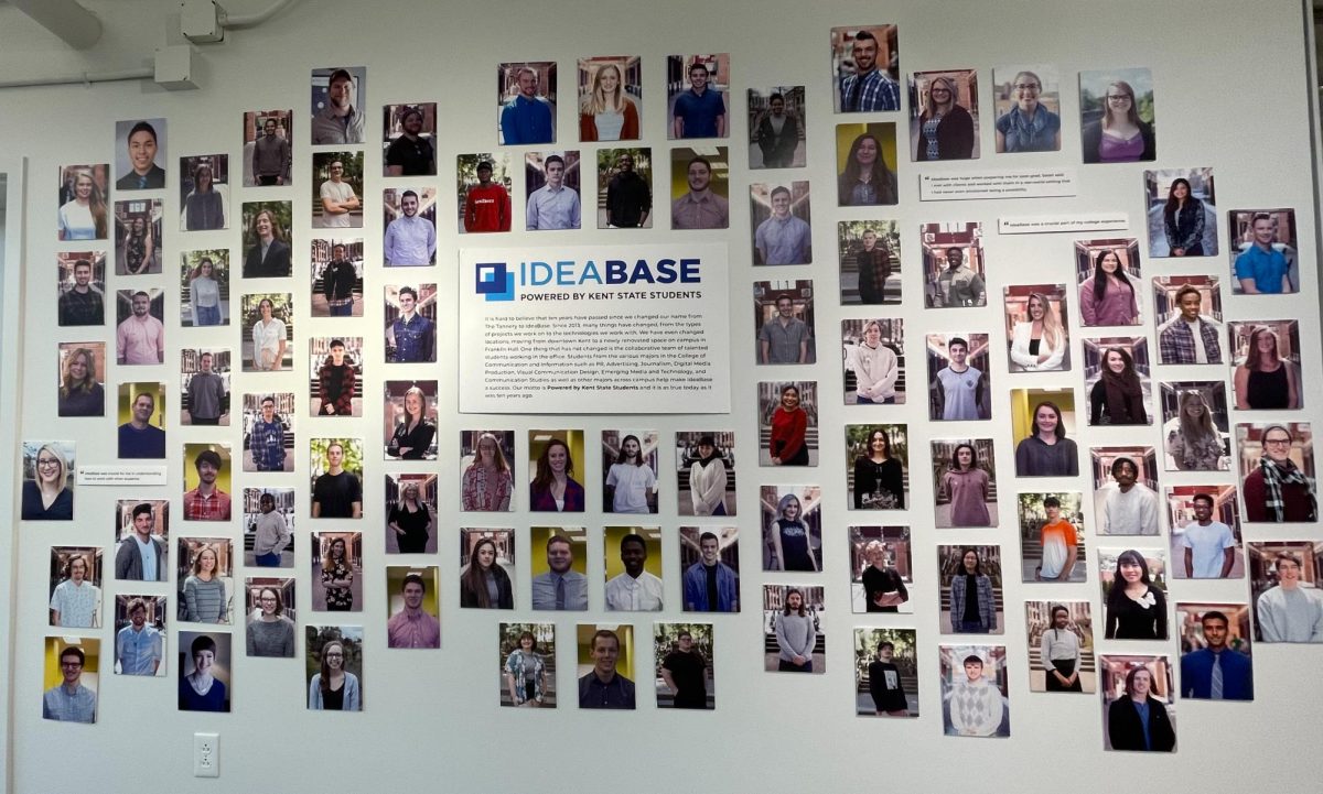 Pictures displaying IdeaBase's past and present employees hang on the wall during the firm's 10 year anniversary celebration on Oct. 20, 2023. 