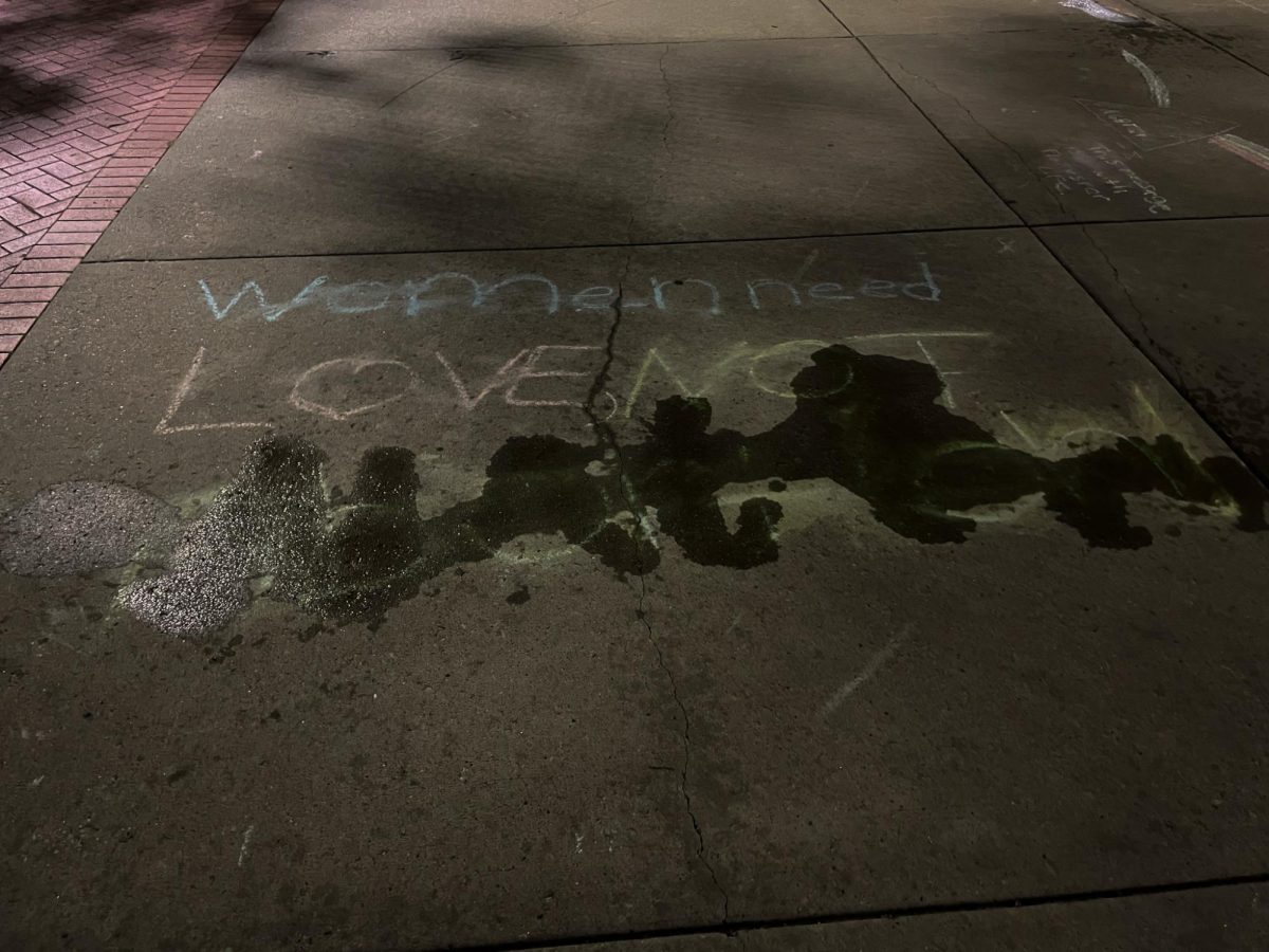 As Issue 1 voting nears, The words "Not Abortion" in chalk are erased with water on the "K" on Oct. 18, 2023. 