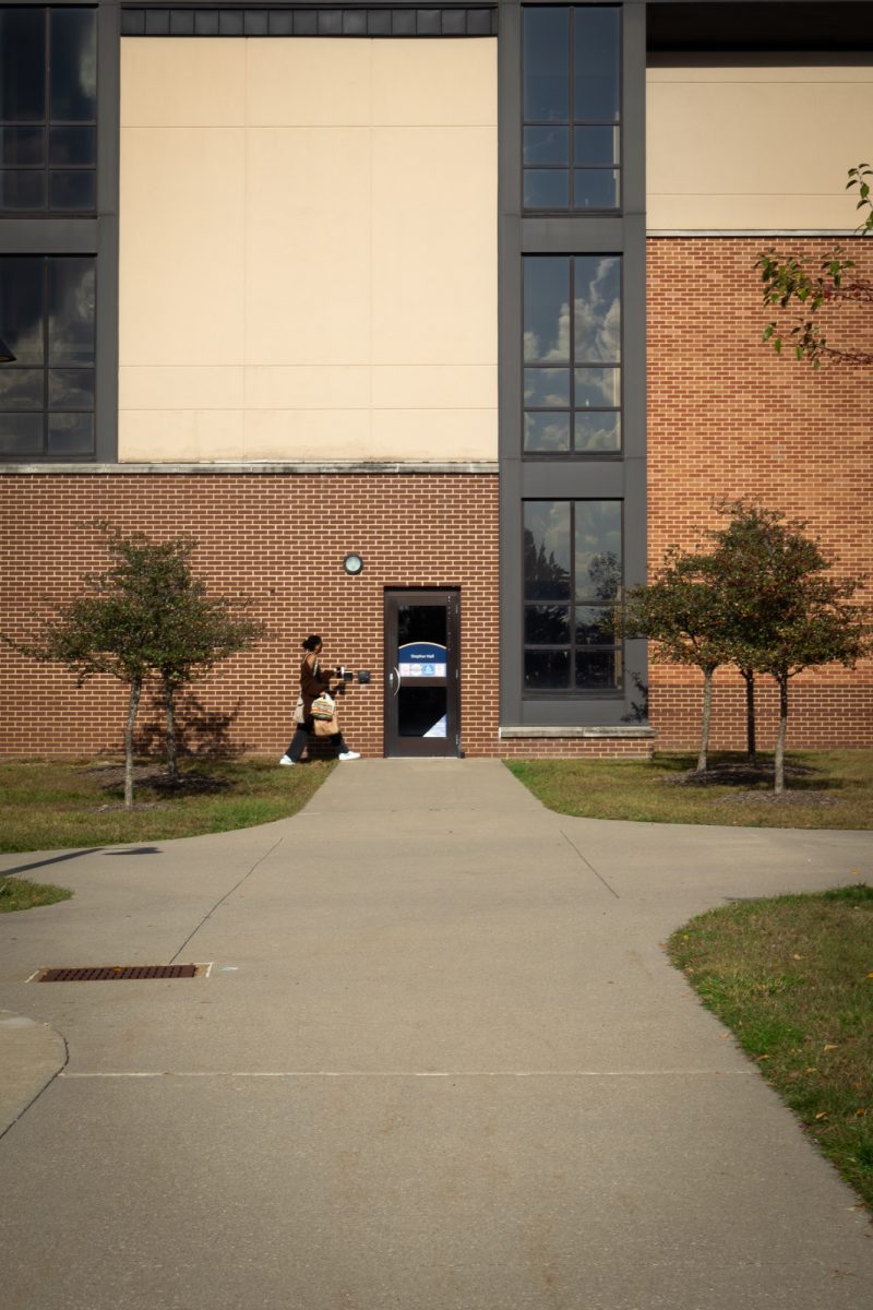 A student returns to the Stopher & Johnson residence hall during fall break on Oct. 6, 2023.