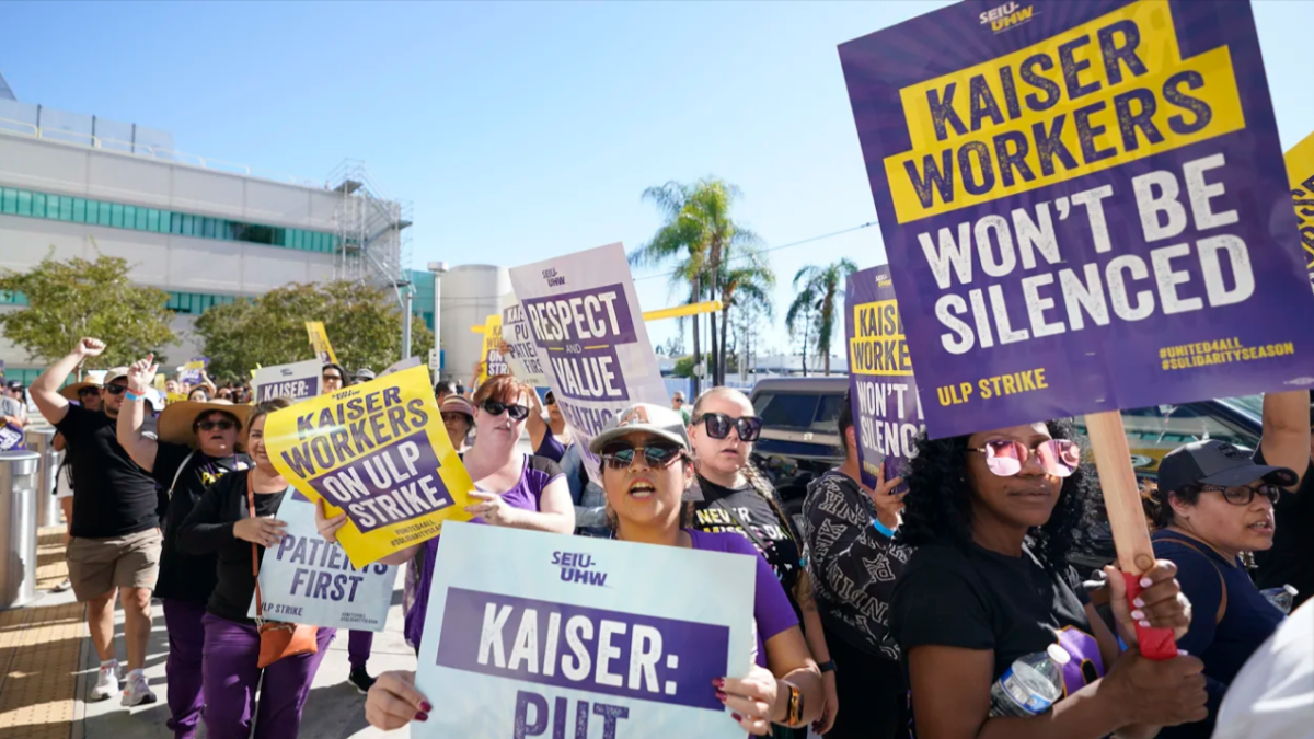 Kaiser Permanente workers picket in California on the second day of a three-day strike earlier this month. The union announced it had reached a tentative deal with Kaiser that could avert a second strike at the health care system.