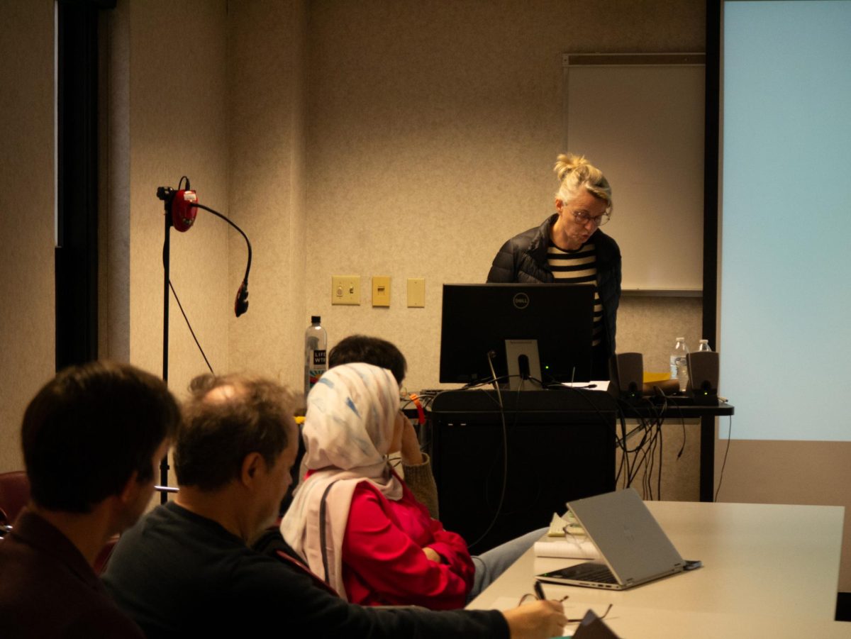 Véronique Béghain lectures to students about her work in translation in Satterfield Hall Oct. 20, 2023.