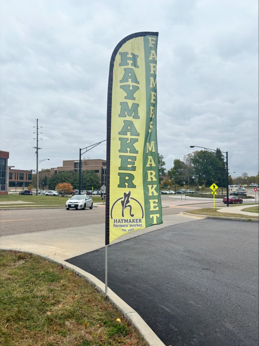 The Haymaker Farmers' Market sign sits near the  entrance of the Campus Rec Lot. 