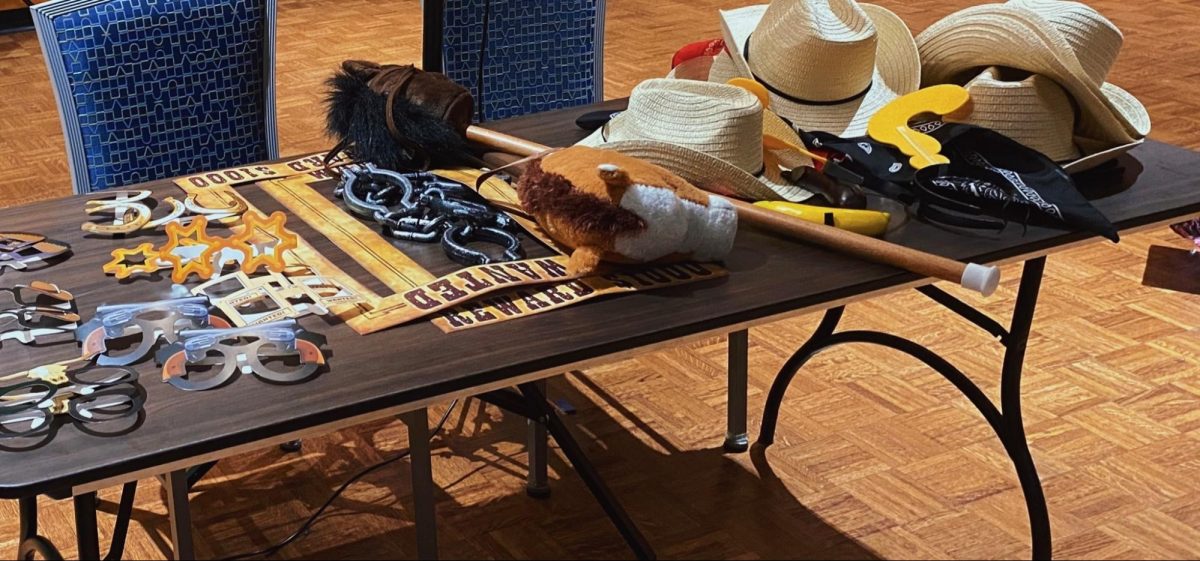 The "Sextoberfest" photo booth displays props that incorporate the “Wild West” theme of the event on Friday, Oct. 27, 2023.