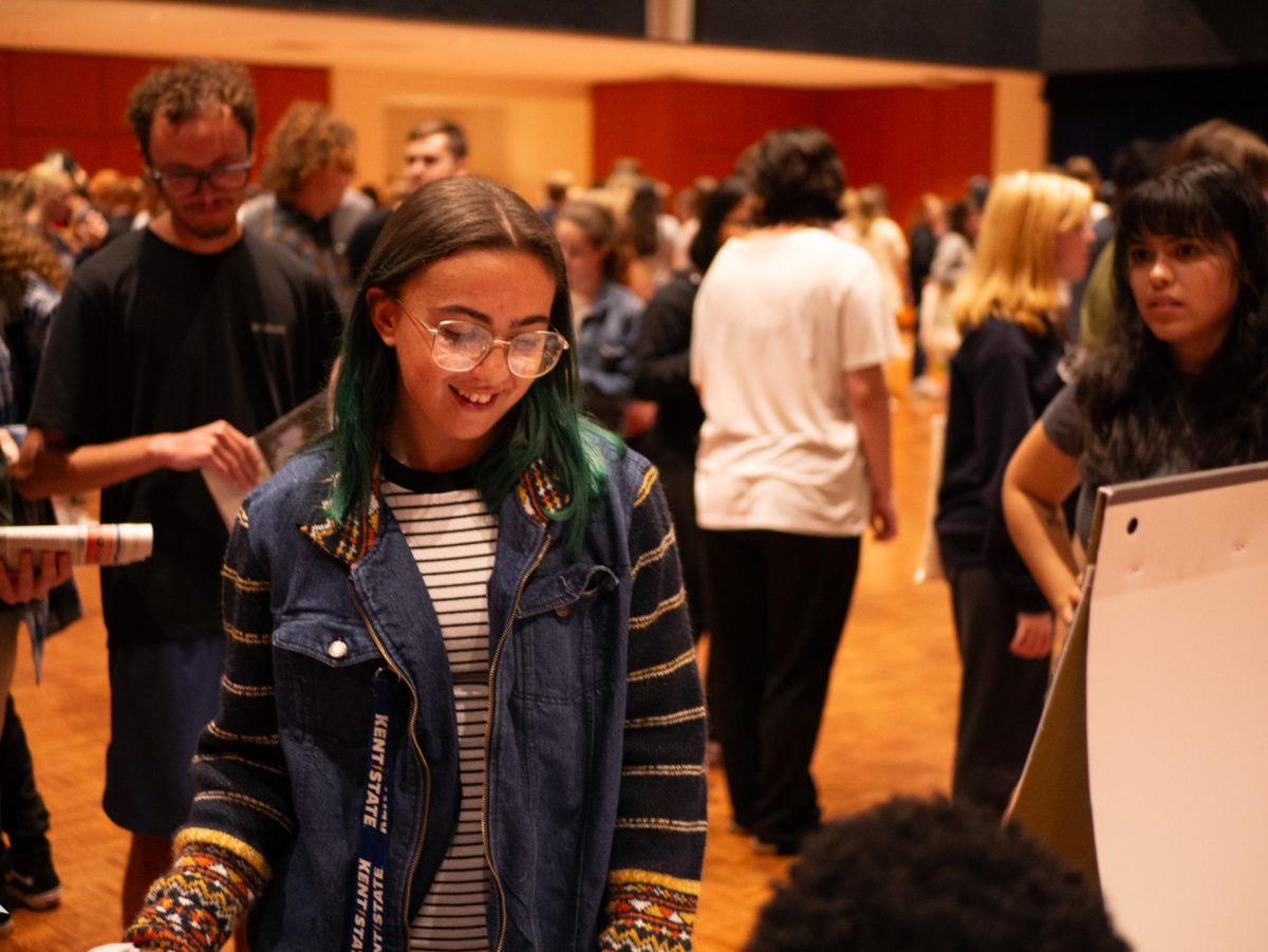 Myiah Sanchez (center left) selects a prize at Kent State's Sextoberfest event Oct. 27, 2023.