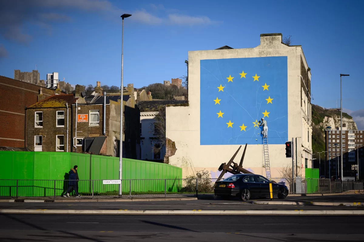 The Banksy mural depicted a workman chipping away at a star on the EU flag in Dover, England.
