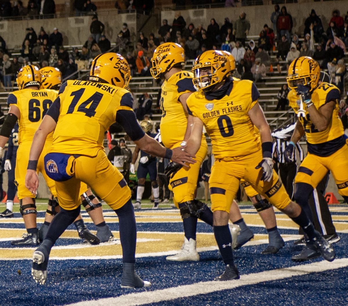 Kent State then sophomore Quarterback Tommy Ulatowski celebrates with then senior Wide Receiver Luke Floriea (0) after they connected for a 19 yard touchdown pass in the second quarter of the Wagon Wheel game at Akron's Infocision Stadium on Nov. 1, 2023.