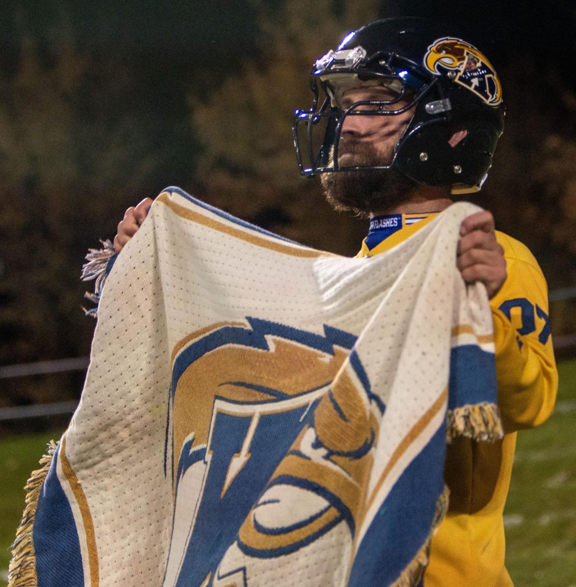 A Kent State fan cheers on the Golden Flashes at the Wagon Wheel game in Akron on Nov. 1, 2023.