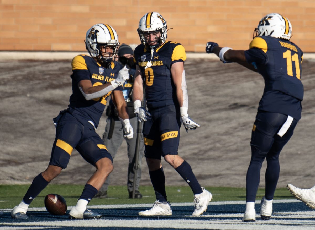 Kent State sophomore wide receiver Trell Harris and senior wide receiver Luke Floriea celebrate with sophomore wide receiver Jameel Gardner Jr. after Gardner's touchdown during the Northern Illinois game on Nov. 25, 2023.