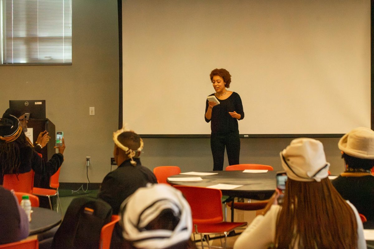 Ubuntu Fellow and Kent State student Adara Mickels reciting a poem she wrote about her personal experience in Africa  at the Heritage Ubuntu Student Fellowship welcome Ceremony on Nov. 30, 2023. 