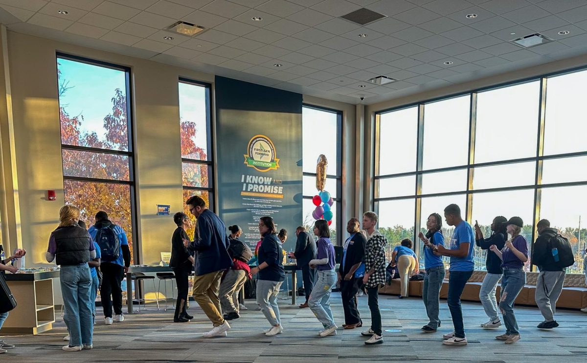 A group of students during the "I Am First" celebration start a line dance on Nov. 8, 2023. 