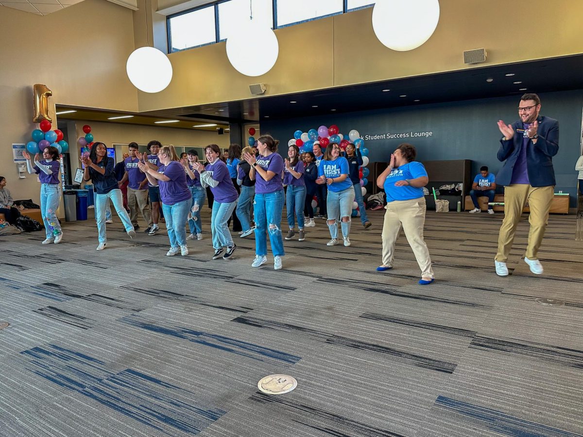 A group of students at the "I Am First" Celebration line dance in the CUE on Nov. 8, 2023. 