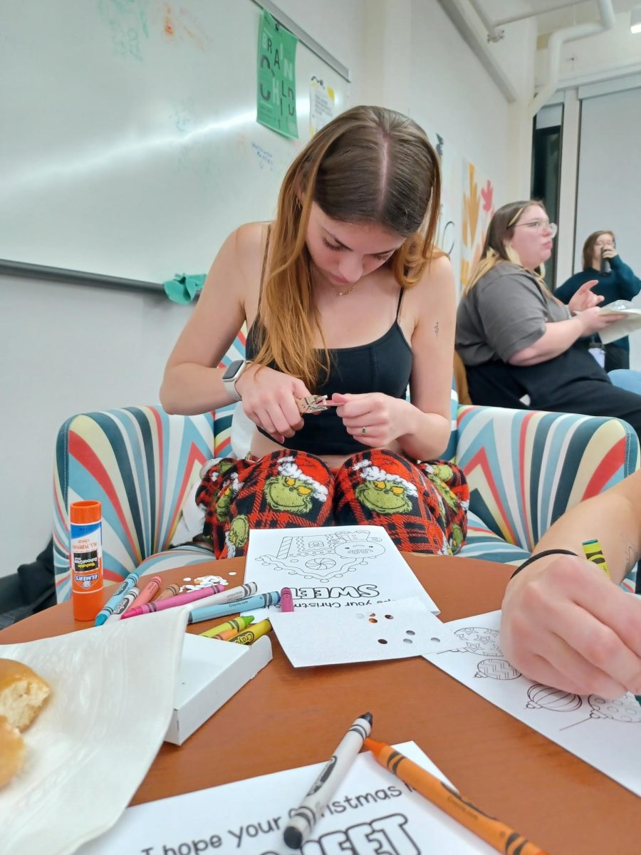 Brenna Johnson working on her Christmas card at AIGA "Wrap Up The Semester" event on Dec. 6, 2023.