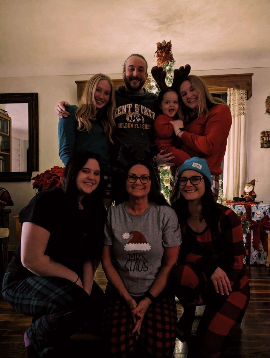 Sophomore healthcare administration major Chloe Kurian and her family wear their holiday attire.