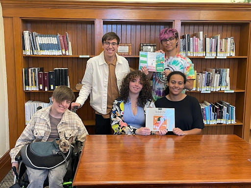 Translation Students displaying the book they translated for the event, “My Friend Federico”