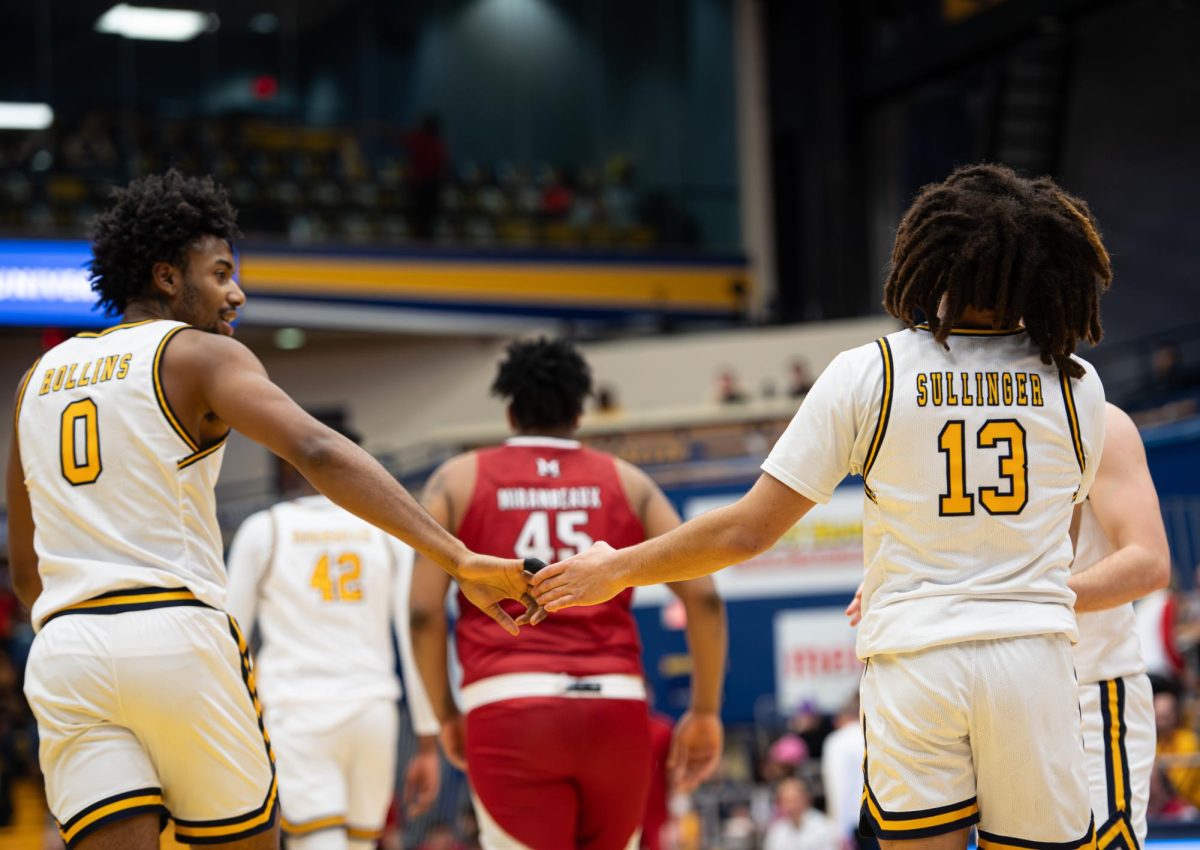 Redshirt sophomore Julius Rollins and freshman Jalen Sullinger high-five after a play during the game against Miami University on Jan. 30, 2024.