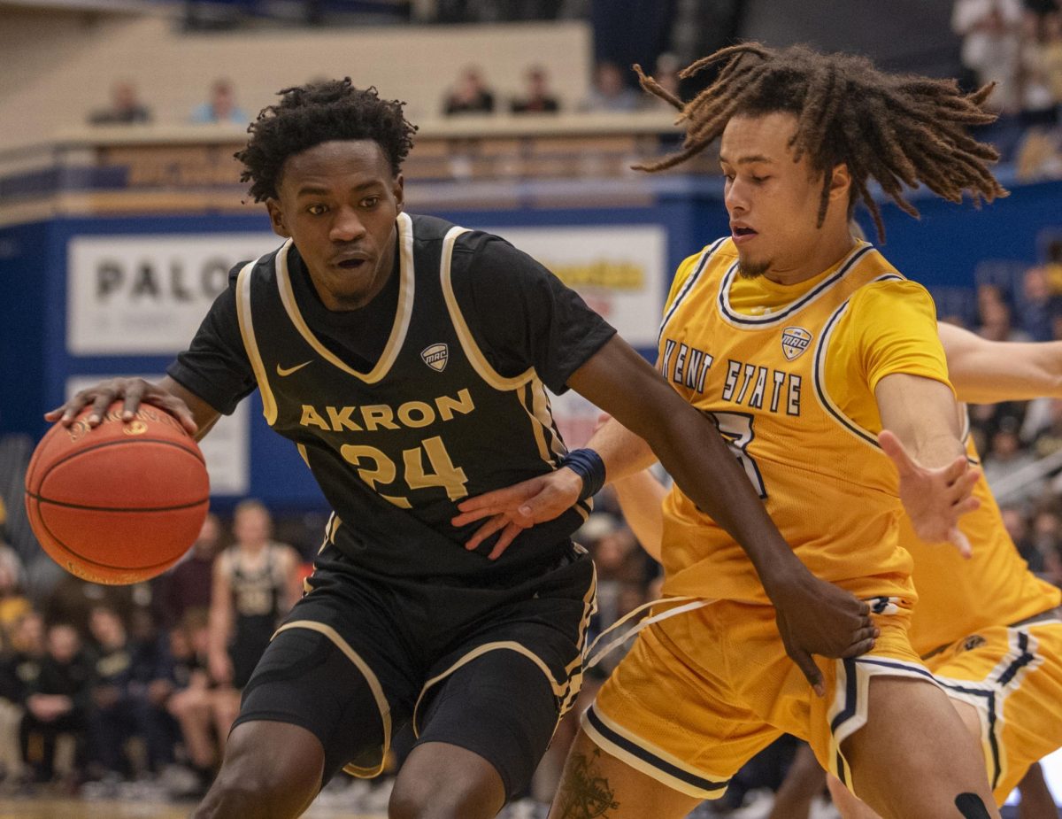 Akron guard Ali Ali attempts to drive by Kent State junior guard Jalen Sullinger early in the Zips' 77-71 win over the Golden Flashes on Jan. 19, 2023. Ali scored 23 points, tying the game high with teammate Enrique Freeman.  