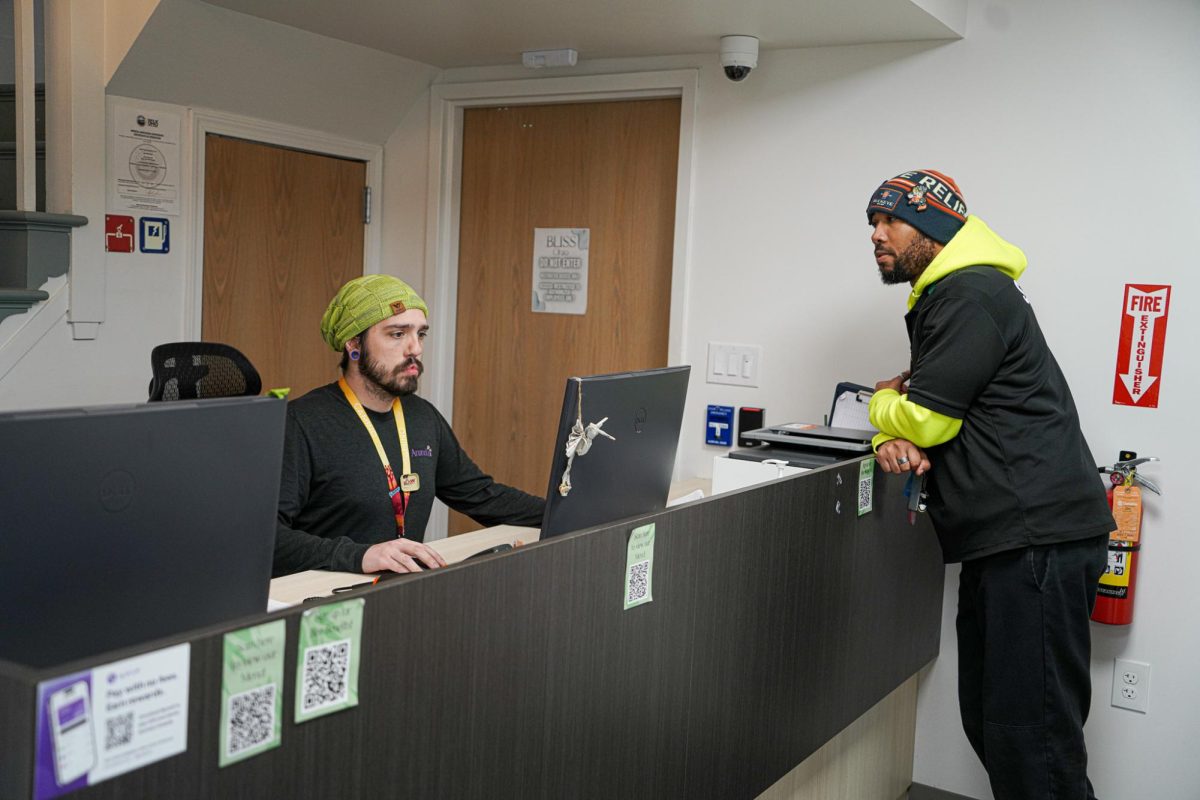 Bliss Ohio Budtenders Shane Bader (left) and Jason Coles (right) working the from counter at the dispensary on January 31, 2024.