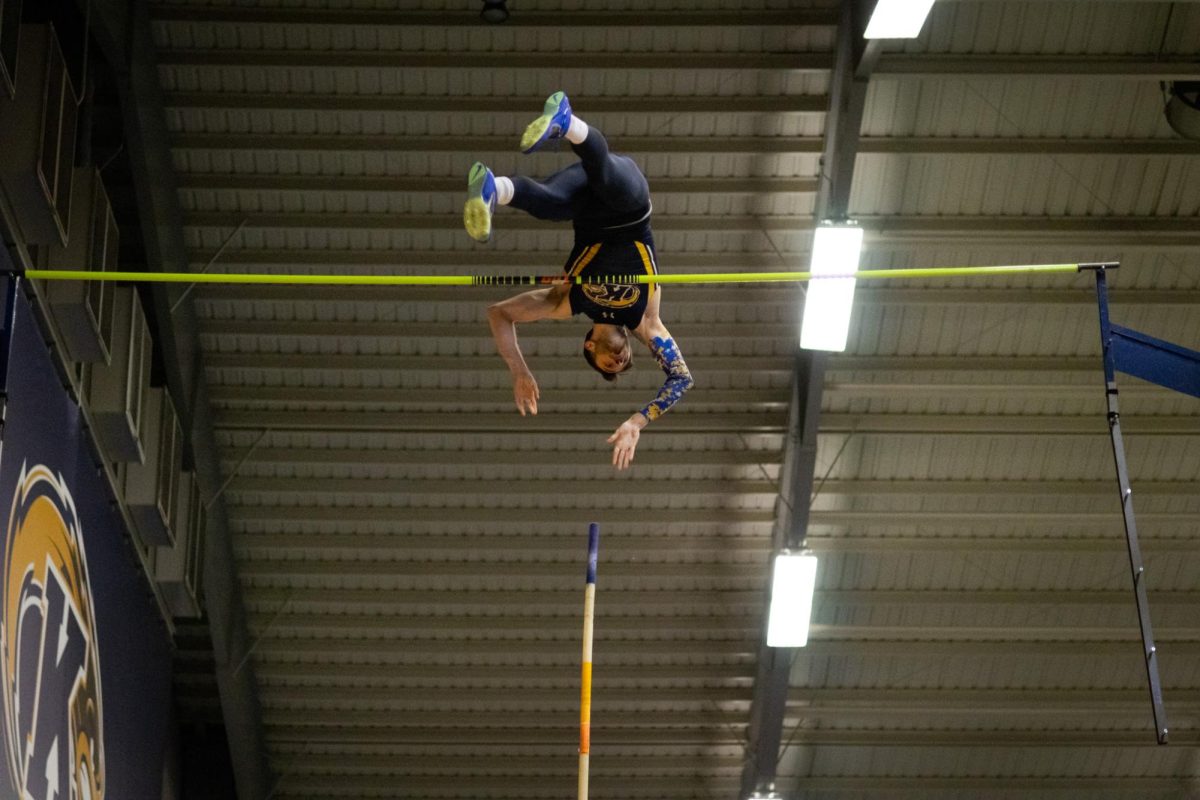 Senior Kristian Kneffler clears 17'-3.50" in the track and field meet against Akron on Jan 19, 2024.  