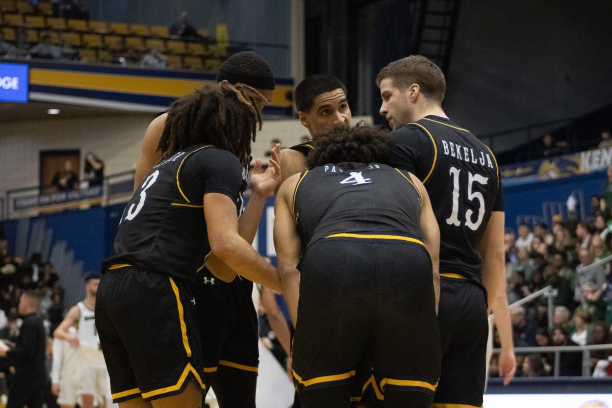 Kent State Men's basketball huddles during the second half of the game against Ohio University Jan. 26, 2024, where they lost 71 to 64. 