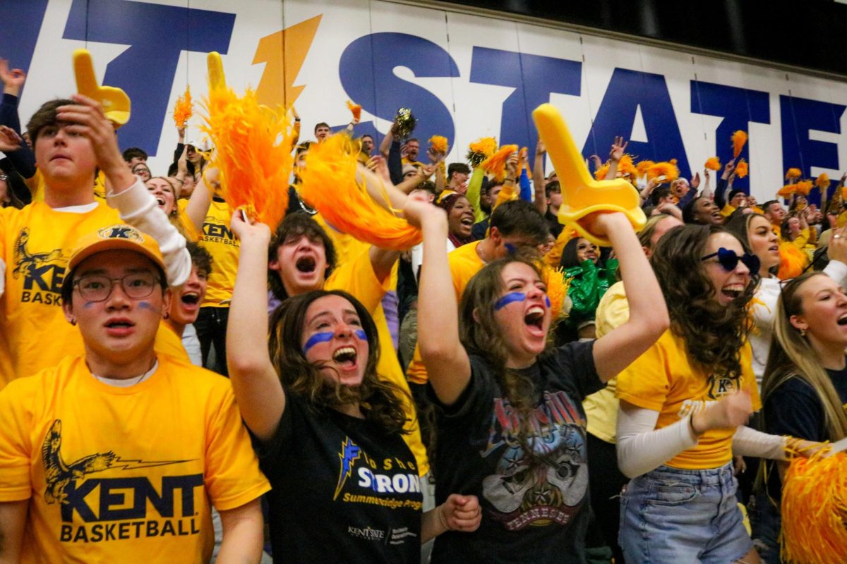 Kent State students celebrate as the men's basketball team scores during the final half of the game against Akron on Jan. 19, 2024. 