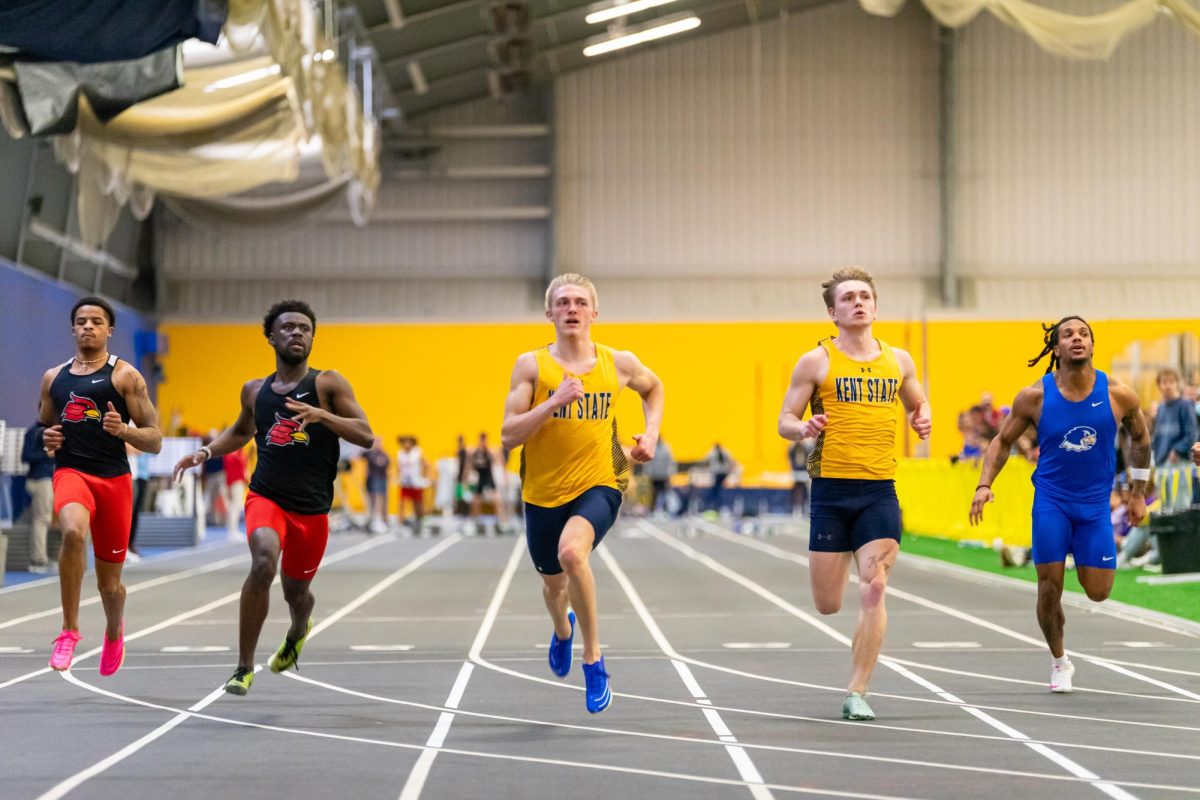 Sophomore Logan Doyle (Left) alongside Freshmen Caleb White (Right) competing in Men's 60 Dash Prelim on Jan. 27, 2024.