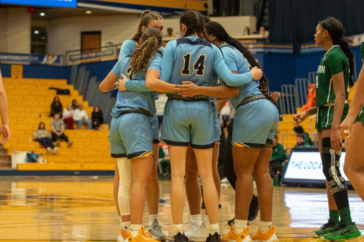 Kent State Golden Flashes huddle during the women's basketball game against Eastern Michigan on Jan. 24, 2024.