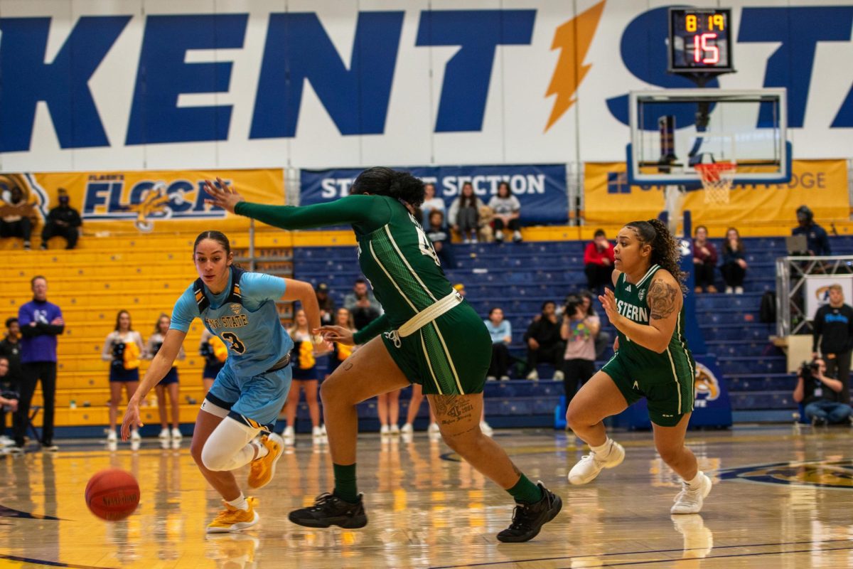 Sophomore Corynne Hauser on offense against two Eastern Michigan University players during the women's basketball game on Jan. 24, 2024.