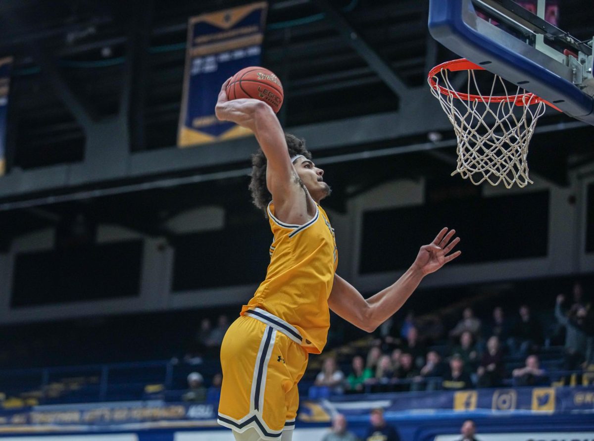 Chris Payton Jr. lands a dunk late in the game against Western Michigan on Feb. 6, 2024.