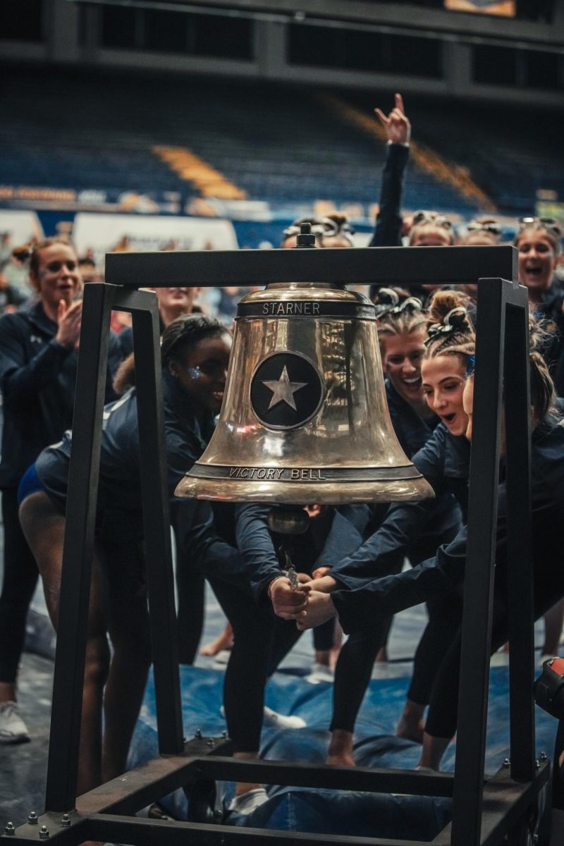 The Flashes celebrate their win by ringing the victory bell.