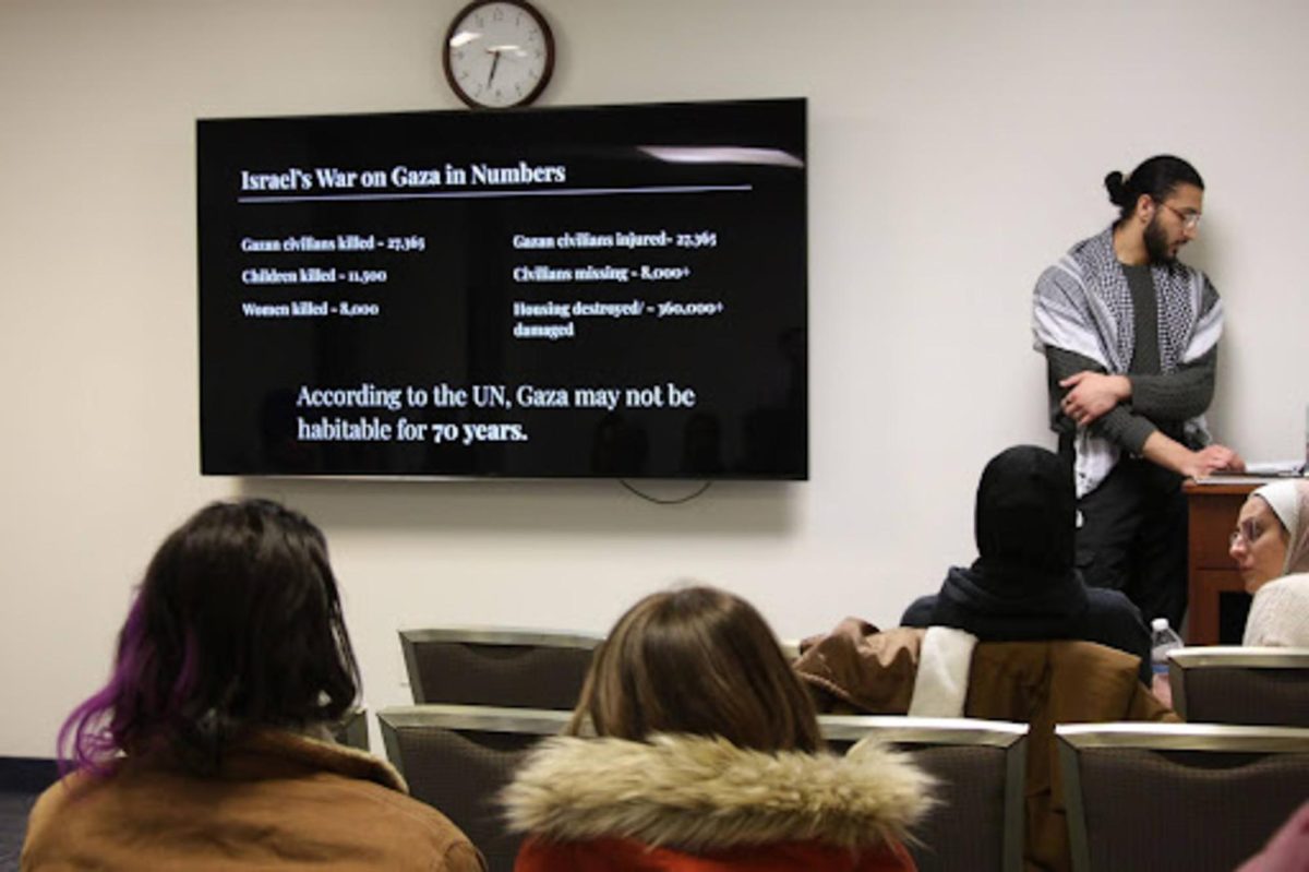 Yaseen Shaikh, President of Students for Justice in Palestine, sharing statistics from the ongoing war in Gaza at the "Let's talk about Gaza" event on Feb. 15, 2024.