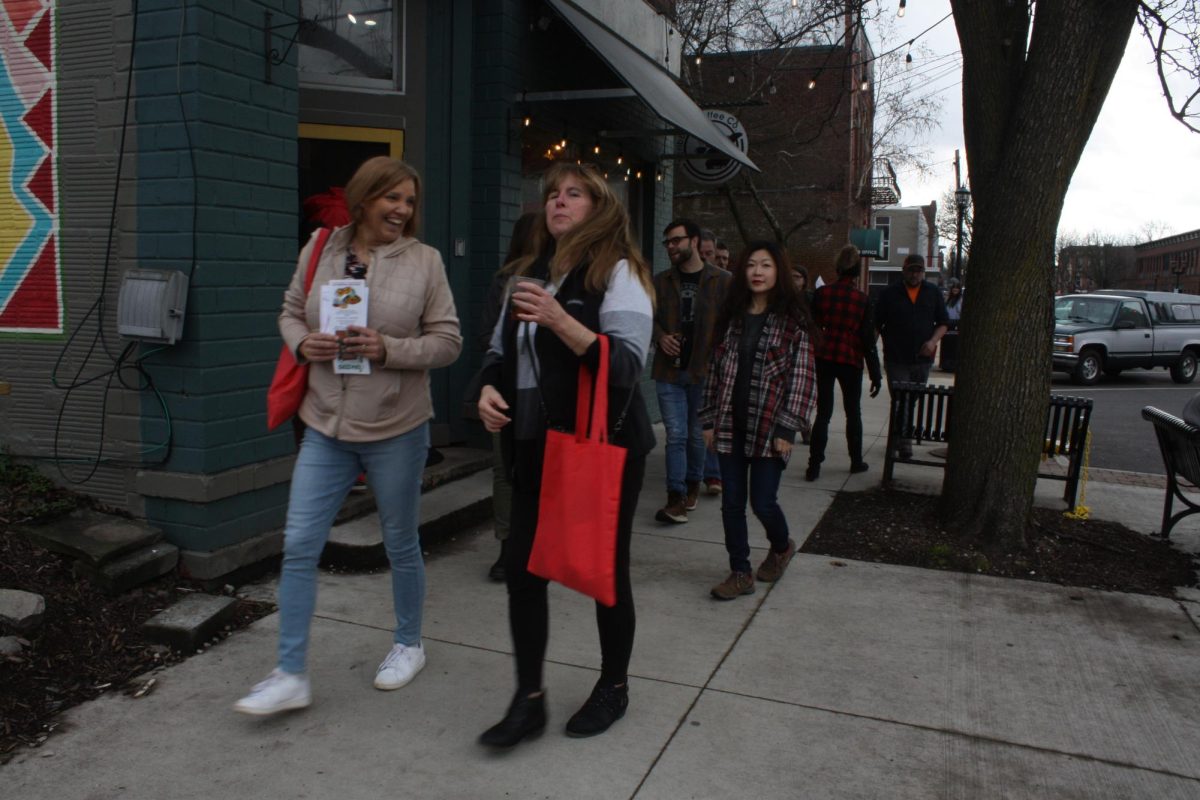 Cheryl Marez (left) and her pickleball group 'In The Kitchen' stroll down Water Street to get more chocolate after stopping for some drinks at Scribbles Coffee Co. on Feb. 10, 2024.