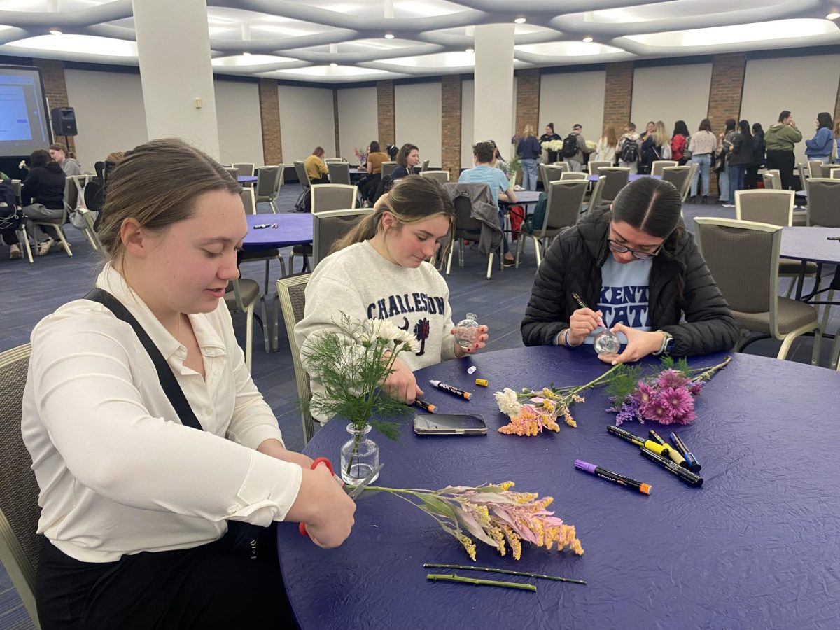 Brodie Sikorski, Ava Hirsch and Alexis Spears create bouquets of flowers at FAB's bouquet making event.