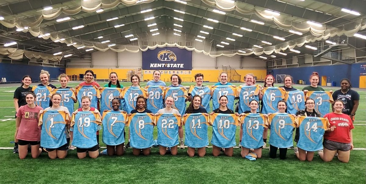 Members of the women's club rugby team hold their jerseys after the last practice of their most recent season in 2023. 