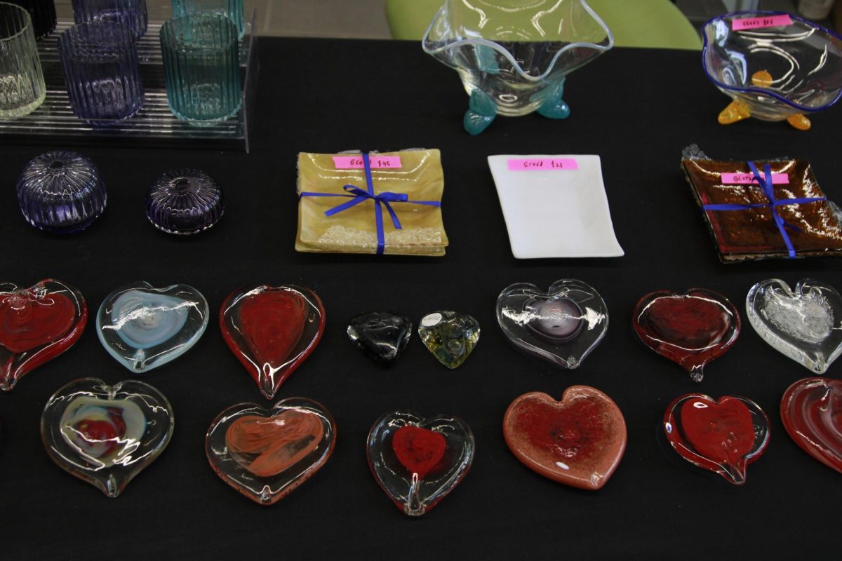 Handmade heart-shaped glass decor sits on display at Kent State's Art Club's annual Valentine's Day sale Feb. 9, 2024 