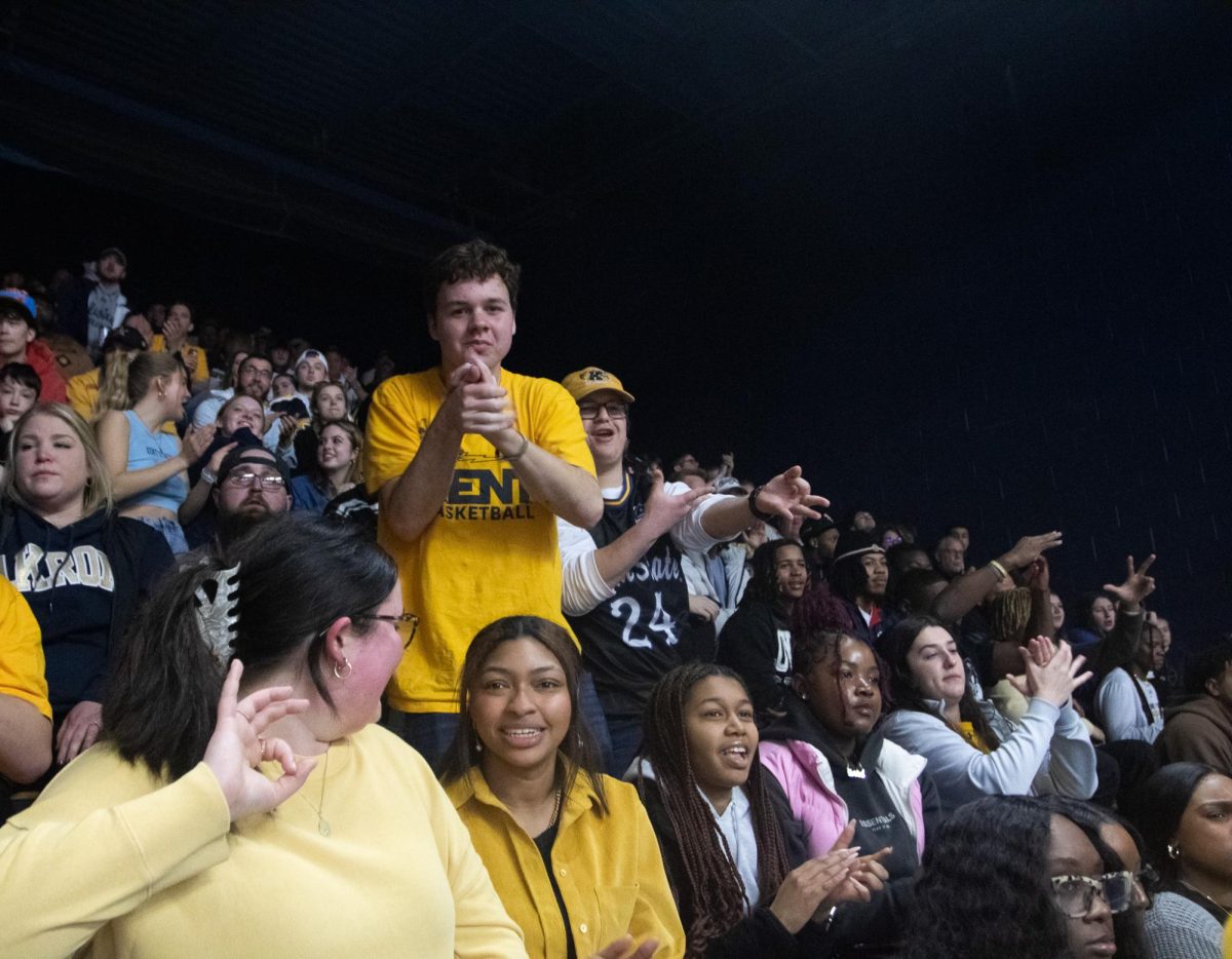 The Kent student section celebrates after a 3-point shot in University of Akron arena on February 23, 2024.