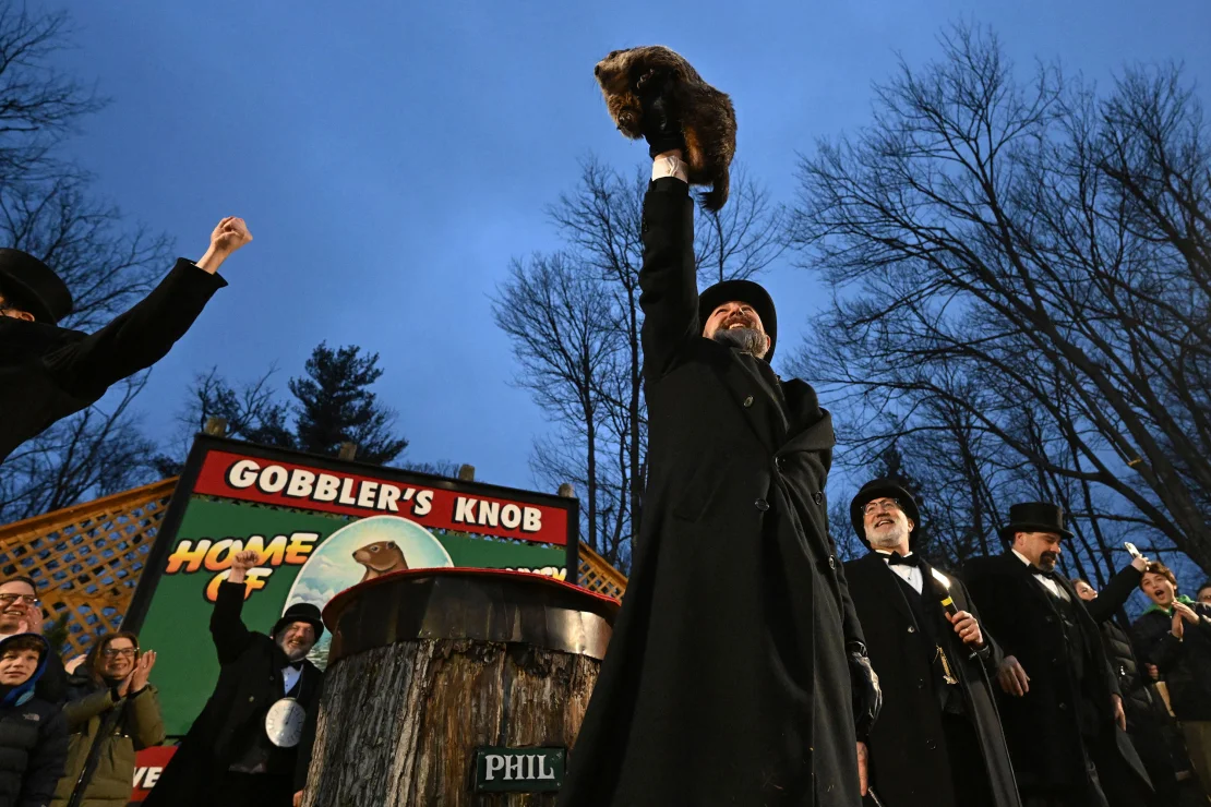 Groundhog Club handler A.J. Dereume holds Punxsutawney Phil, the weather prognosticating groundhog, during the 138th celebration of Groundhog Day in Punxsutawney, Pa., on Friday, Feb. 2, 2024.